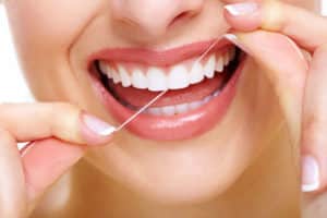 Keeping gums healthy by flossing